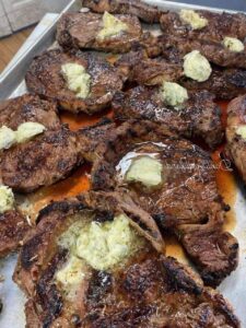 Grilled Ribeye Steaks with Herb Butter