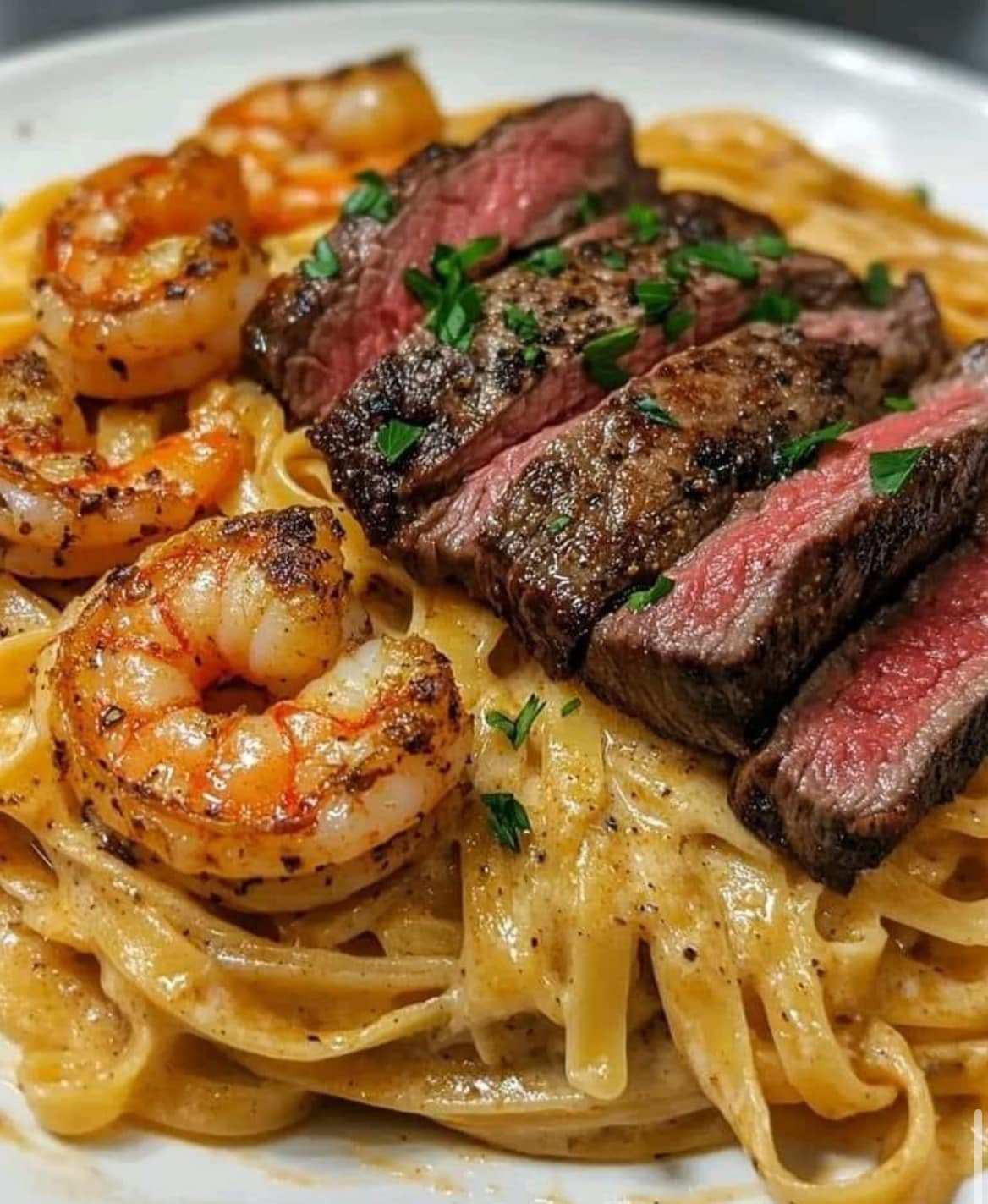 CAJUN SHRIMP AND STEAK ALFREDO PASTA