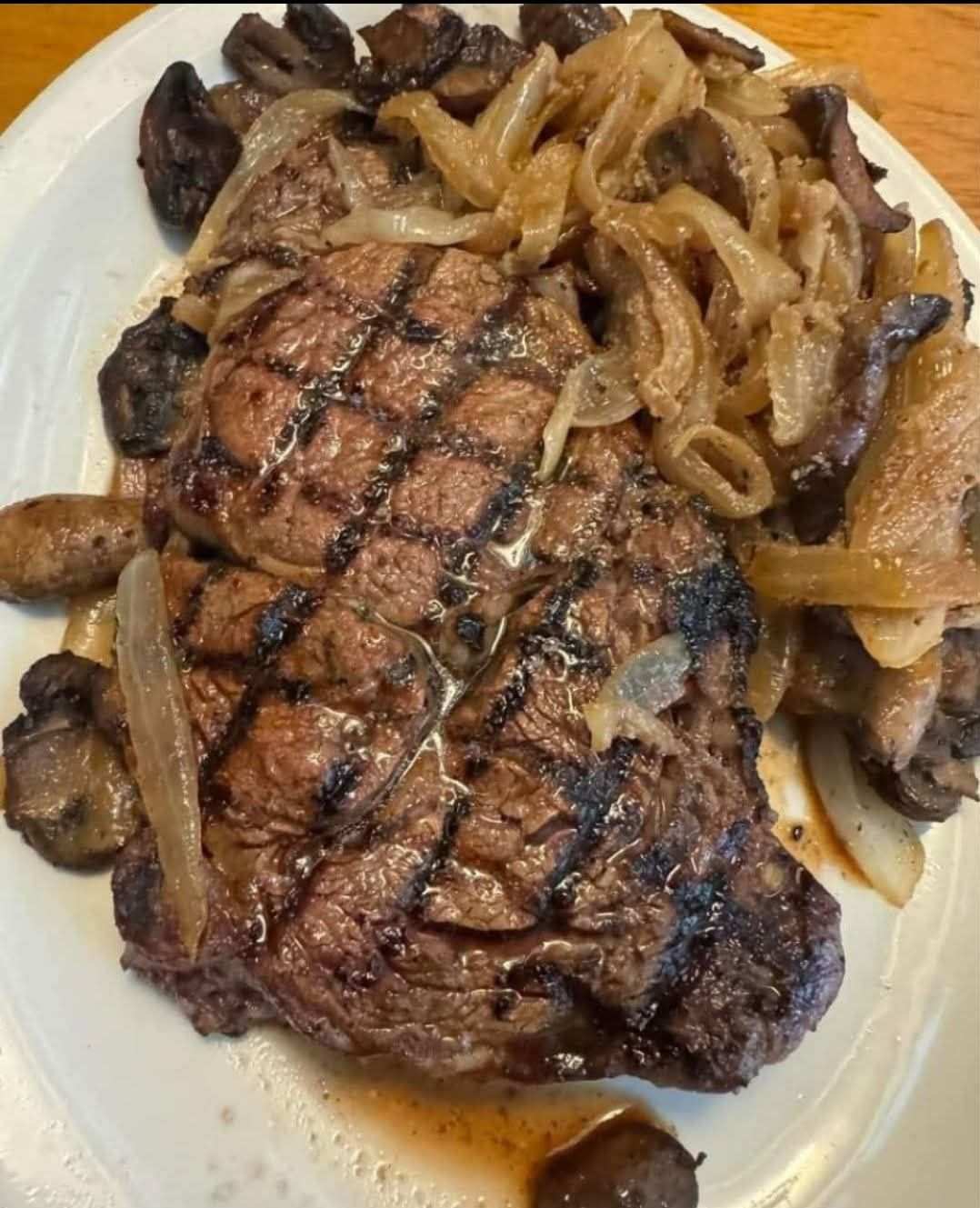 Grilled Steak with Sautéed Onions