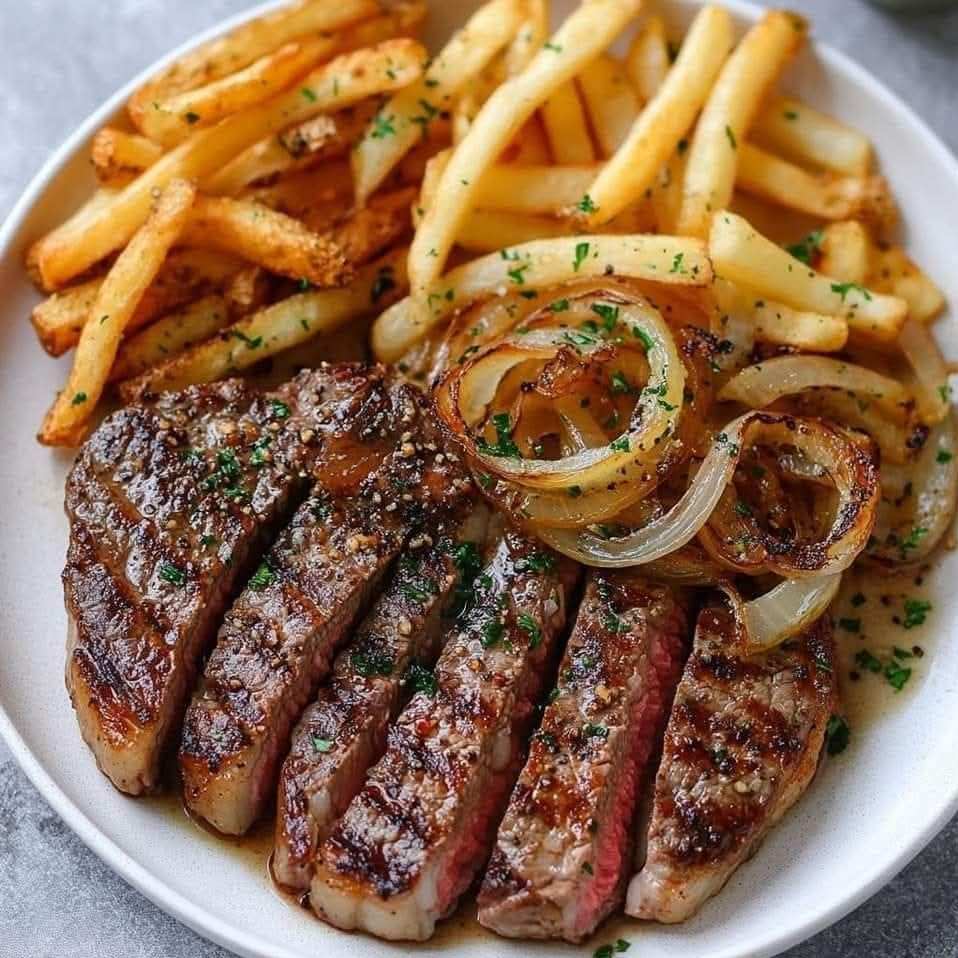 Ribeye Steak with Onions and Fries